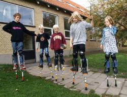 group of kids on stilts